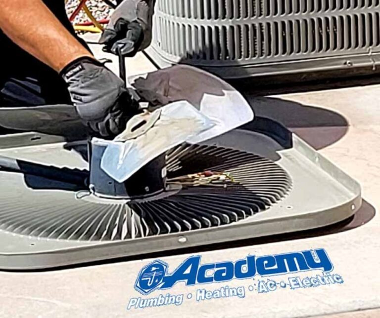 Academy Plumbing technician repairing an air conditioner condenser fan in Albuquerque